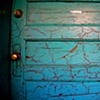 behind the turquoise door