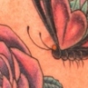 kick ass butterfly and rose tattoo by paul nolin