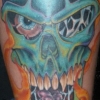 kick ass skull tattoo by paul nolin