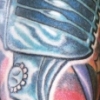 kick ass microphone tattoo by paul nolin