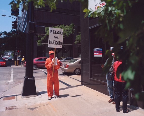 Protester,Grand Opening Huckabee for President Iowa Headquarters, Des Moines, Iowa. June 13, 2007