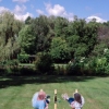 Two men on a lawnyard