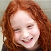 Laughing red-headed girl