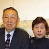 Dr. and Mrs. Saito with Kathleen King's paintings.