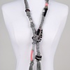 LONG GREY PINK CROSSOVER NECKLACE