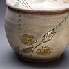 yellow tomato covered jar