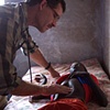 Missionary doctor examining young boy