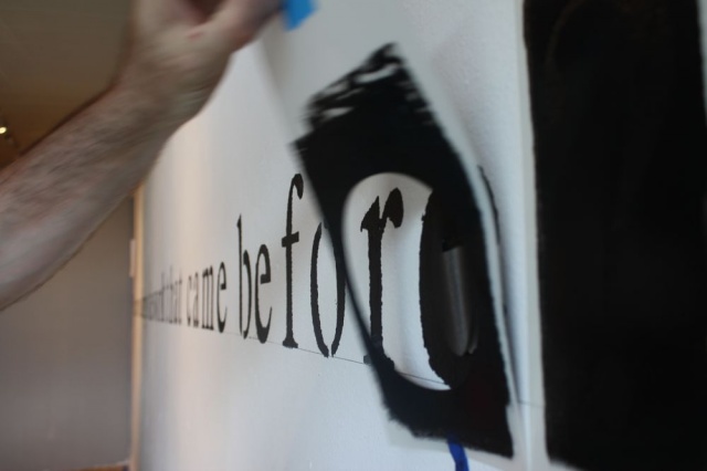 Applying text to the south wall