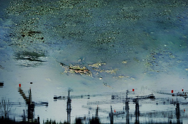 Han Bing, "Urban Amber Series: Red Flags Flying on Skylines Cranes"