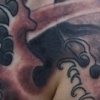 Skull and  Waves Tattoo by Little Chico 2005