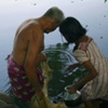 Grandfather and his Granddaughter Fishing, Kerala, India.