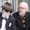 One of these artist's is dressed up as an Old man