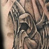 cloaked figure