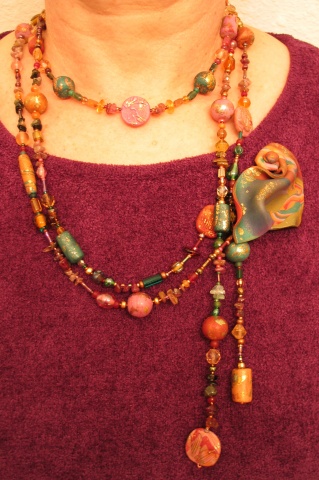 BEADS DRAPED WITH PIN