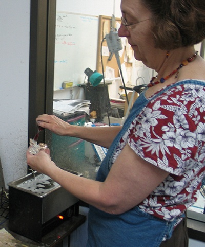 POLISHING RESIDUE IS SCRUBBED OUT 