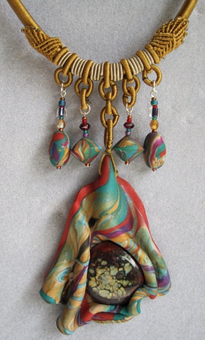 polymer clay pendant with lampwork cab feature