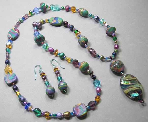 necklace/earring set features a double lampwork glass bead pendant and 12 polymer clay beads handmade by Nancy Denmark