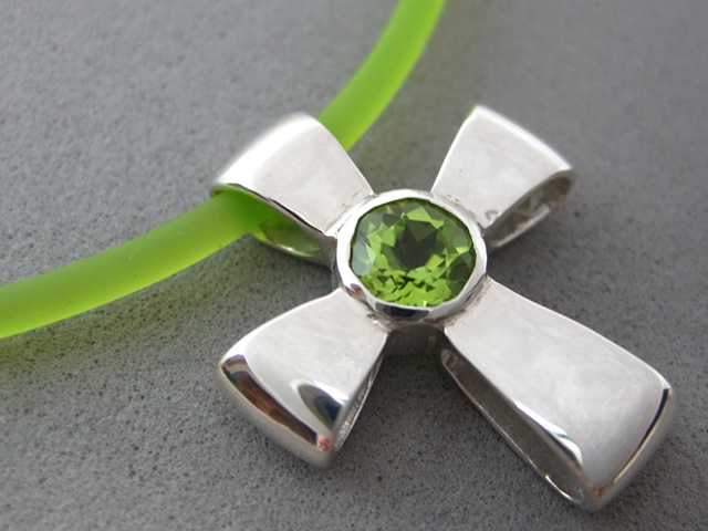 sterling silver ribbon cross with faceted peridot
