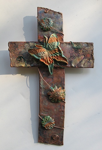 copper wall cross with polymer clay butterfly & flower embellishment