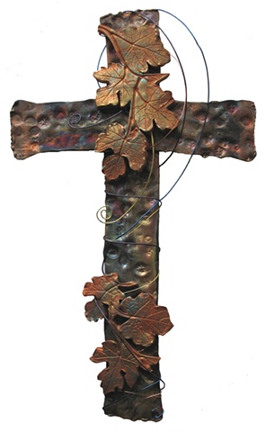 CROSS ENTWINED IN GRAPE LEAVES