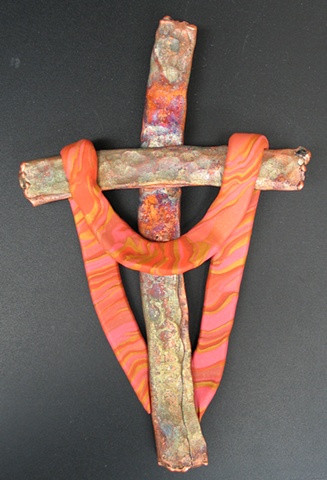 copper wall cross embellished with a polymer clay shroud 