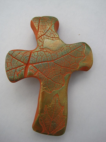 leaf impressed hand held cross