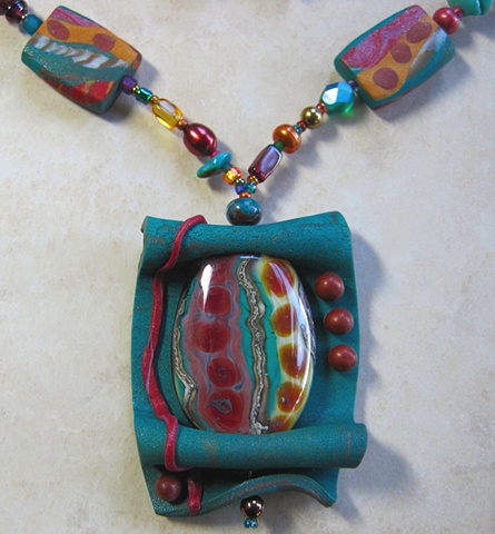 polymer clay pendant frames a lampwork bead