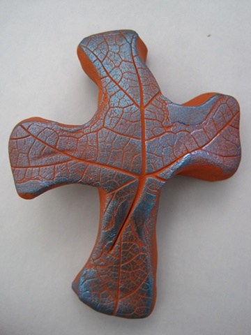 leaf impressed hand held cross