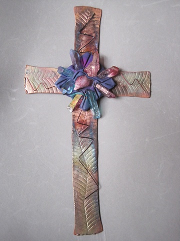 copper wall cross embellished with crystals, clay, and wire