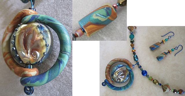 polymer clay pendant built around lampwork bead