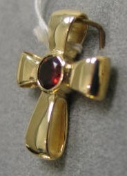 14K ribbon cross with faceted garnet gemstone by Nancy Denmark