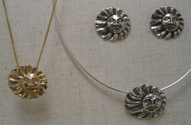 SUN FACES GOLD AND SILVER