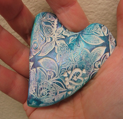 HEART NESTLED IN OPEN HAND