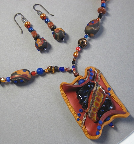 POLYMER CLAY PENDANT FEATURING LAMPWORK BEAD