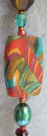 close up view of handmade polymer clay bead