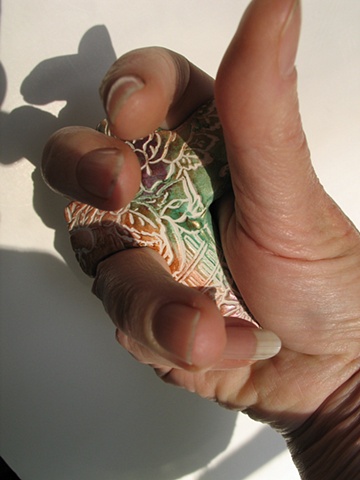 A CROSS IN CLOSING HAND