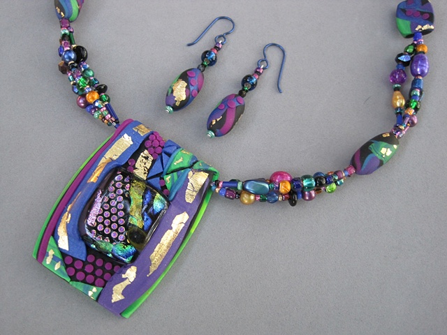 beaded polymer clay pendant featuring fused glass focal