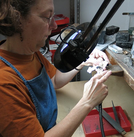 WORKING UNDER MAGNIFYING LAMP