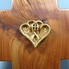 ONE IN THE SPIRIT POLYMER CLAY SYMBOL ON CEDAR CROSS 
CLOSE UP VIEW