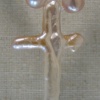 CLOSE UP FRESHWATER PEARL CROSS ON PEARL STRAND
