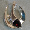 H18 THE SPIRIT IN MOTION  W/ RED GARNET