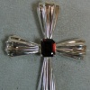 H4 FLUTED CROSS W/ EM. CUT GARNET