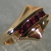 14K RING WITH CHANNEL OF RUBIES VIEW 2