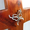 STERLING SPIRIT WIND BENEATH MY WINGS BUTTERFLY ON CEDAR CROSS 
CLOSE UP VIEW