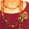 BEADS DRAPED WITH PIN