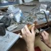 SAWING THE SPRUE REMAINS FROM CROSS