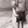 fisherman with reef shark