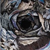"The Spiral of Time, The Black Whole of Space"