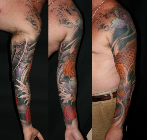 Koi fish sleeve with lotus flowers and hannya mask.