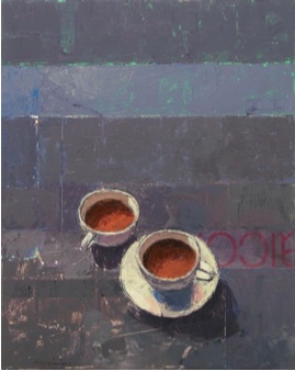 Two white cups on blue/gray